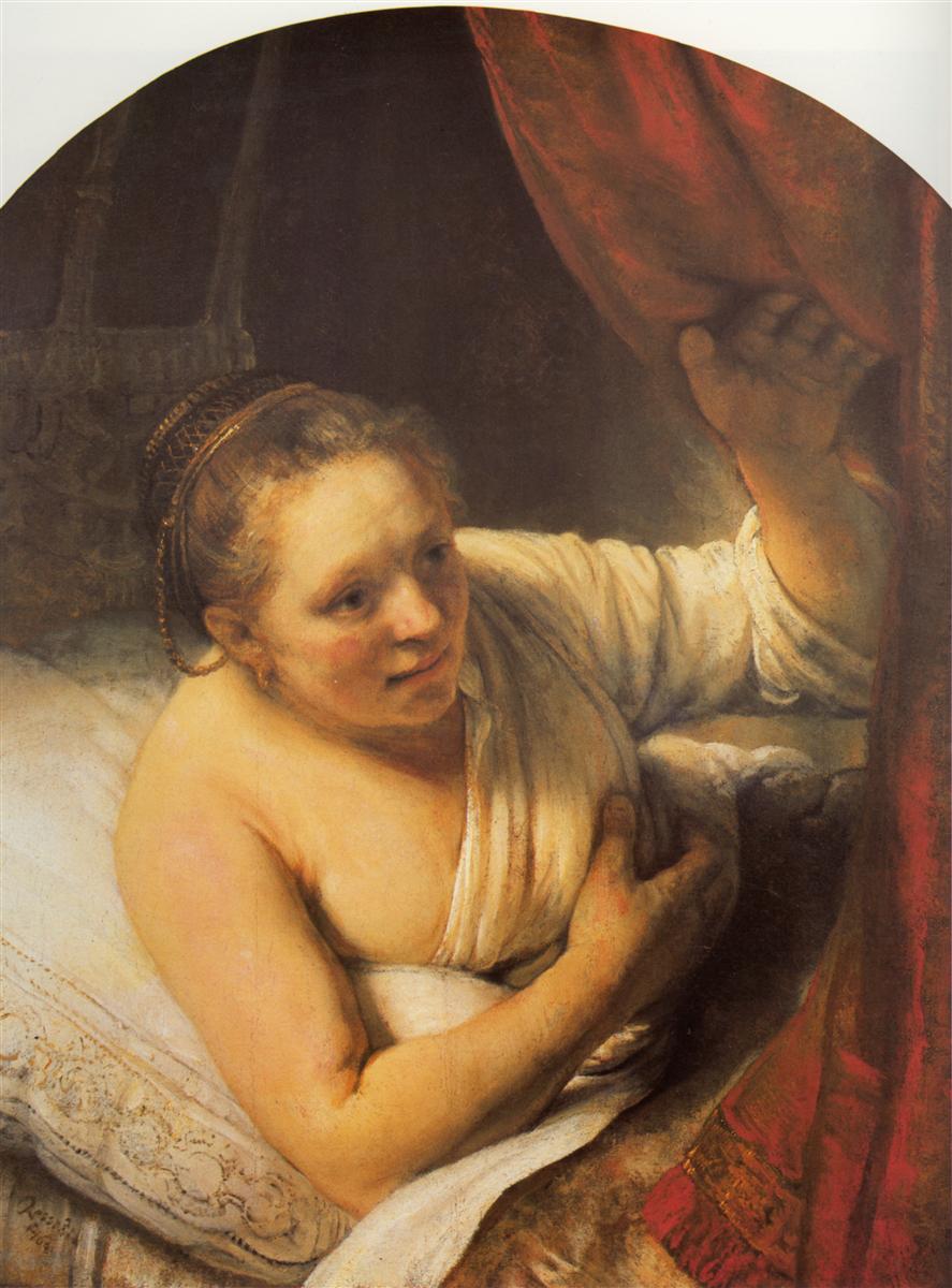 A half-draped woman rises from pillows and draws aside a rich red curtain, her face warmly lit and her other hand resting against her chest; embroidered linens and soft shadows create an intimate bedroom scene.