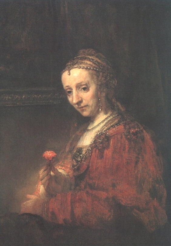Oil portrait of a young woman in a red gown holding a pink carnation; warm light falls on her face, hands, and flower while the background recedes into dark brown, highlighting pearls, embroidered trim, and the contemplative tilt of her head.