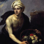 Baroque painting of a bare chested young man in a pale turban holding a basket filled with assorted fruit, his body lit against a dark background with a glimpse of cloudy sky at the top.