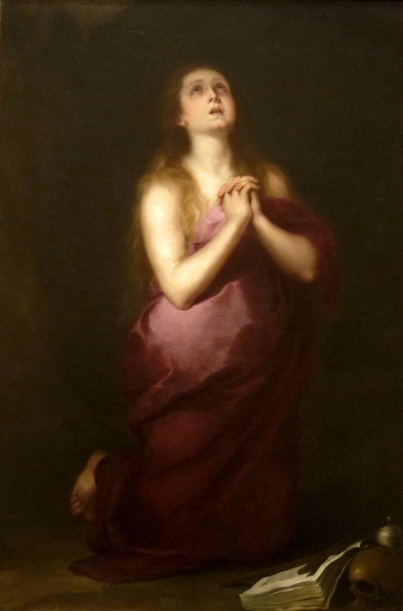 Painting by Bartolomé Esteban Murillo showing Saint Mary Magdalene kneeling alone in a dark space, wrapped in a deep red robe, hands clasped at her chest and eyes raised toward heaven, with a skull, open book, and small jar resting on the ground beside her.
