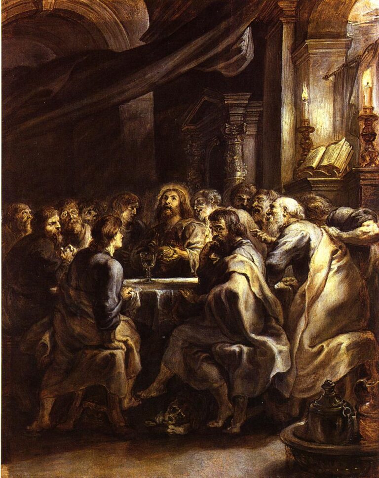 Baroque painting by Peter Paul Rubens showing Christ at the center of a crowded, candlelit table with the apostles gathered tightly around him as he blesses the bread during the Last Supper, framed by massive architecture, dark drapery, and glowing candles.