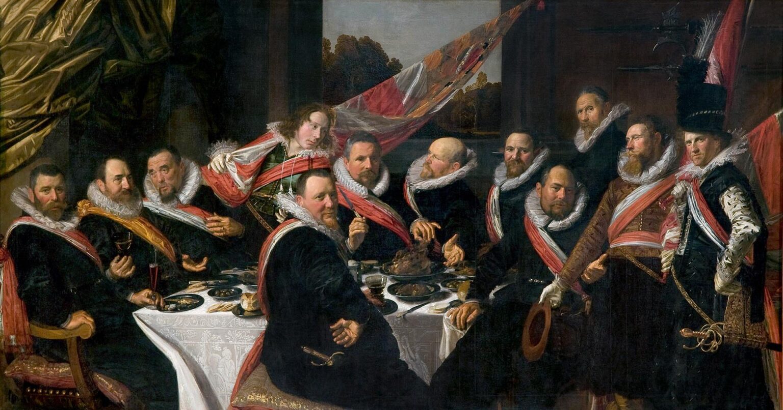 Group portrait of Dutch militia officers at a banquet table with white ruffs, red and white sashes, food, goblets, and a large flag in the background, painted by Frans Hals in 1616.
