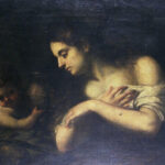 Half length Mary Magdalene with bare shoulders folds her arms across her chest in a dark setting while a small angel leans in beside a jar, both softly illuminated against a shadowy background in Bartolomé Esteban Murillo’s “Repentant Magdalene with an Angel.”
