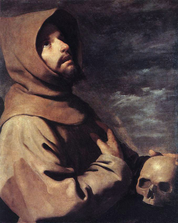 Half length St. Francis in a brown hooded habit stands against a dark cloudy sky, one hand pressed to his chest and the other resting on a skull, while he looks upward into a dramatic light.