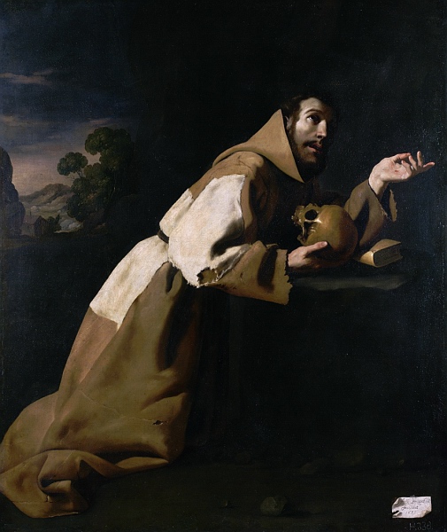 Painting by Francisco de Zurbaran showing St Francis of Assisi kneeling in a brown patched habit in a dark interior, holding a skull against his chest beside an open book on a stone ledge, his face turned upward into a beam of light with a small strip of landscape visible at the left.