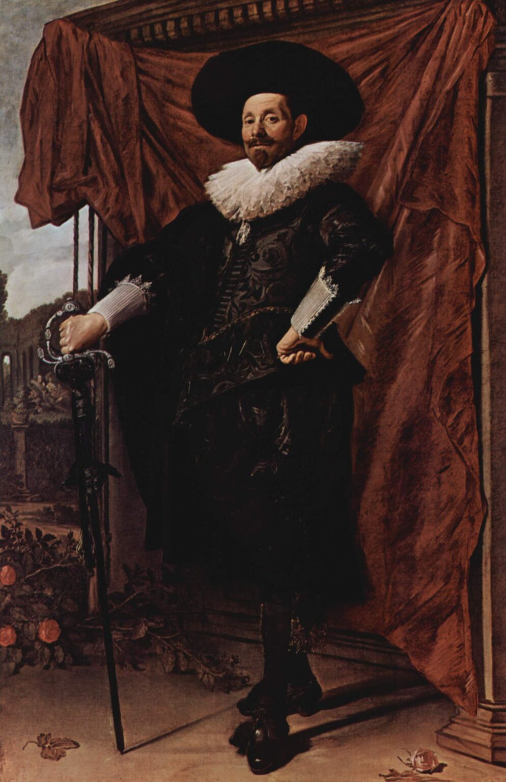 A richly dressed man in a wide black hat and bright white ruff stands confidently with a cane before a large red curtain and column, with a glimpse of landscape at left, painted by Frans Hals in 1625.