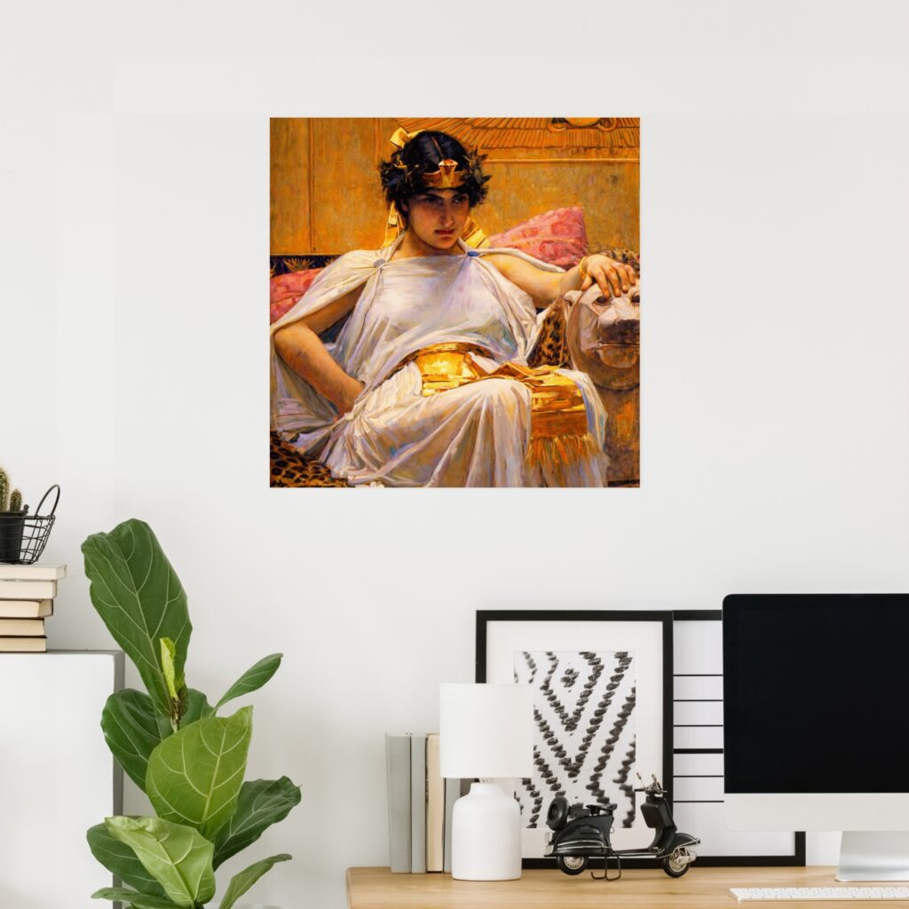 Mockup of a wall poster featuring “Cleopatra” by John William Waterhouse, showing Cleopatra reclining in a white robe with gold accents, displayed above a desk in a modern home office with a plant and computer.
