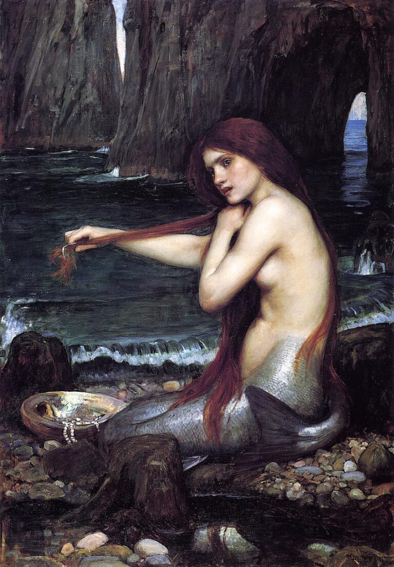 John William Waterhouse’s 1900 painting “A Mermaid,” showing a red-haired mermaid with a silver-scaled tail seated on a rocky shore, combing her hair beside a mirror and pearls, with dark cliffs and the sea behind her.