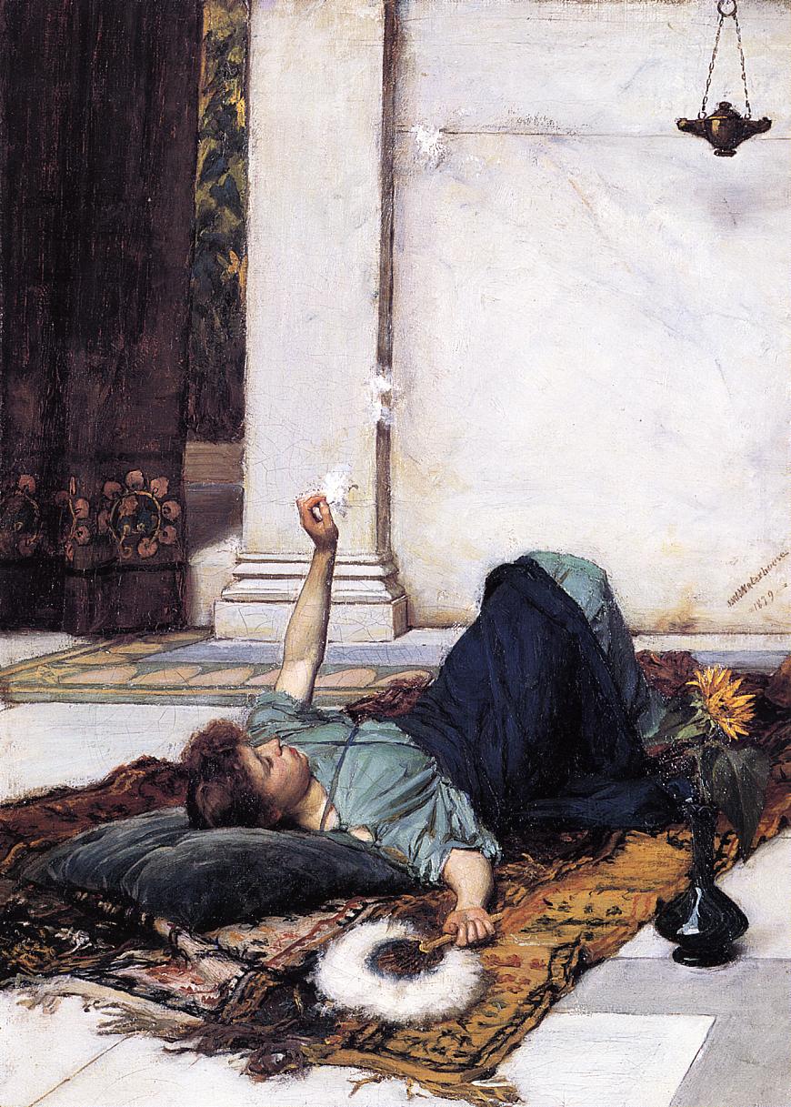 A young woman reclines on layered patterned rugs on a tiled floor, resting her head on a dark cushion and holding a cigarette as wisps of smoke rise toward a pale wall; a hanging lamp and a sunflower in a dark vase complete the quiet interior scene.