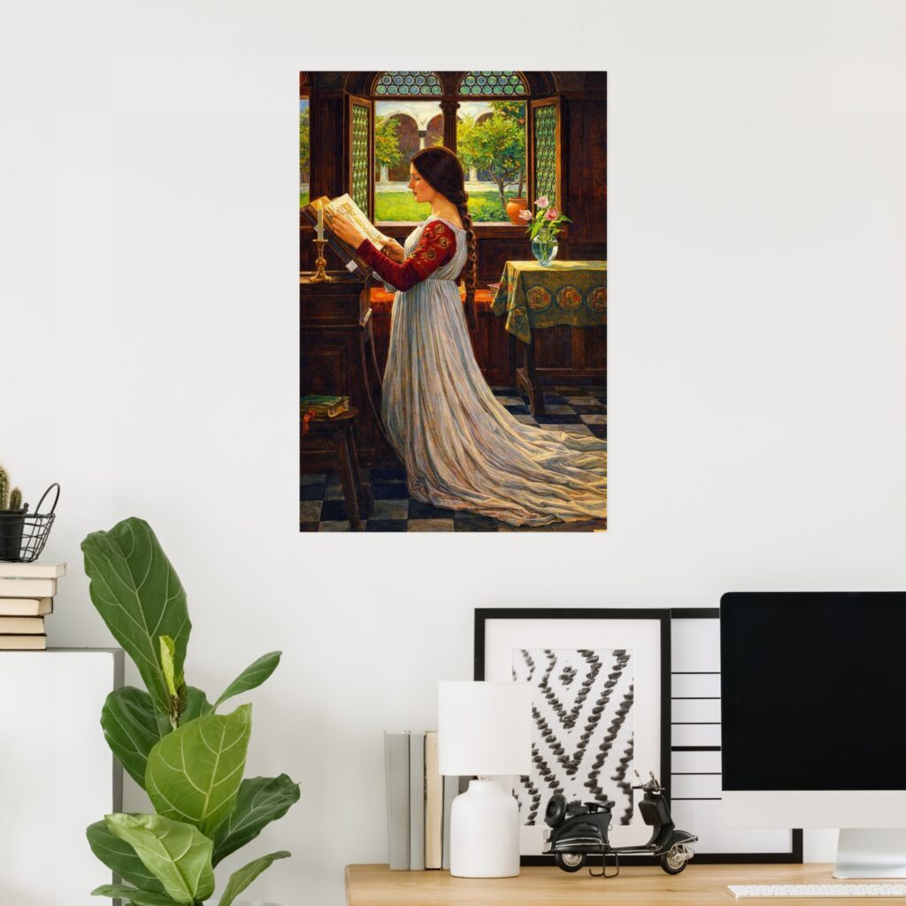 Poster of “The Missal” by John William Waterhouse, featuring a woman reading at a medieval window in a sunlit interior, displayed on a white wall above a modern home office desk with a computer and green houseplant.