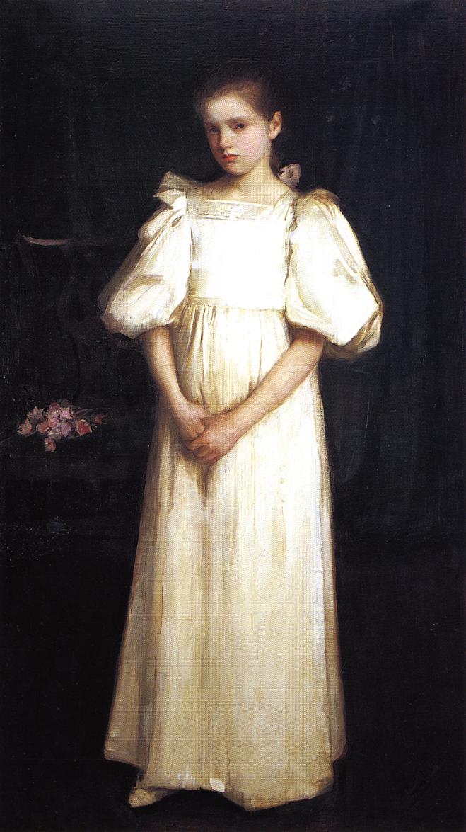 Full length portrait of a young girl in a white dress with puffed sleeves, hands clasped, standing against a dark interior with a small cluster of pink flowers on the left, painted by John William Waterhouse in 1895.