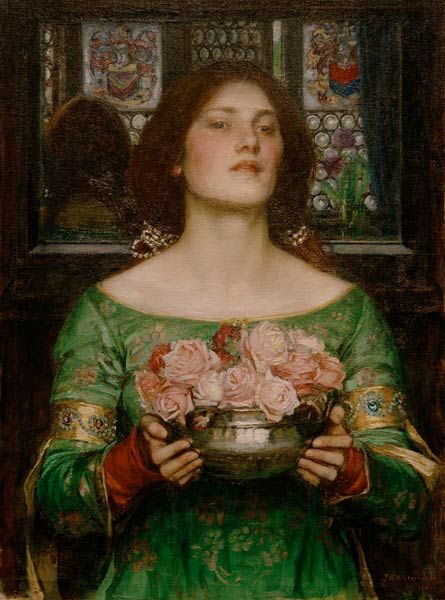 A young woman in a green dress holds a shallow bowl filled with pink roses, facing forward with a calm, poised expression, with stained glass panels behind her in a dark interior, painted by John William Waterhouse in 1908.