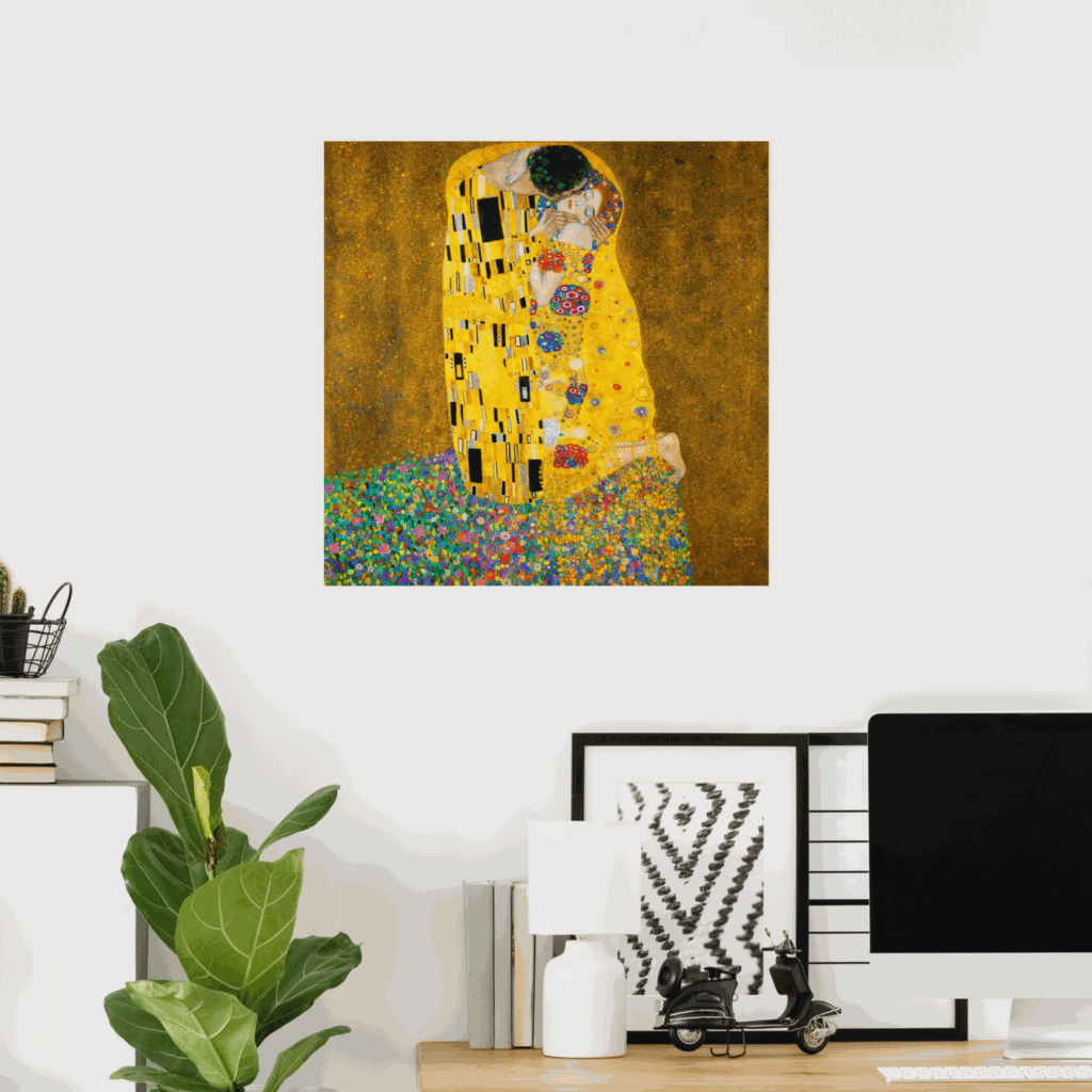 Poster of The Kiss by Gustav Klimt featuring a golden embracing couple with ornate patterns and a colorful flower meadow, displayed as wall art in a modern home office.