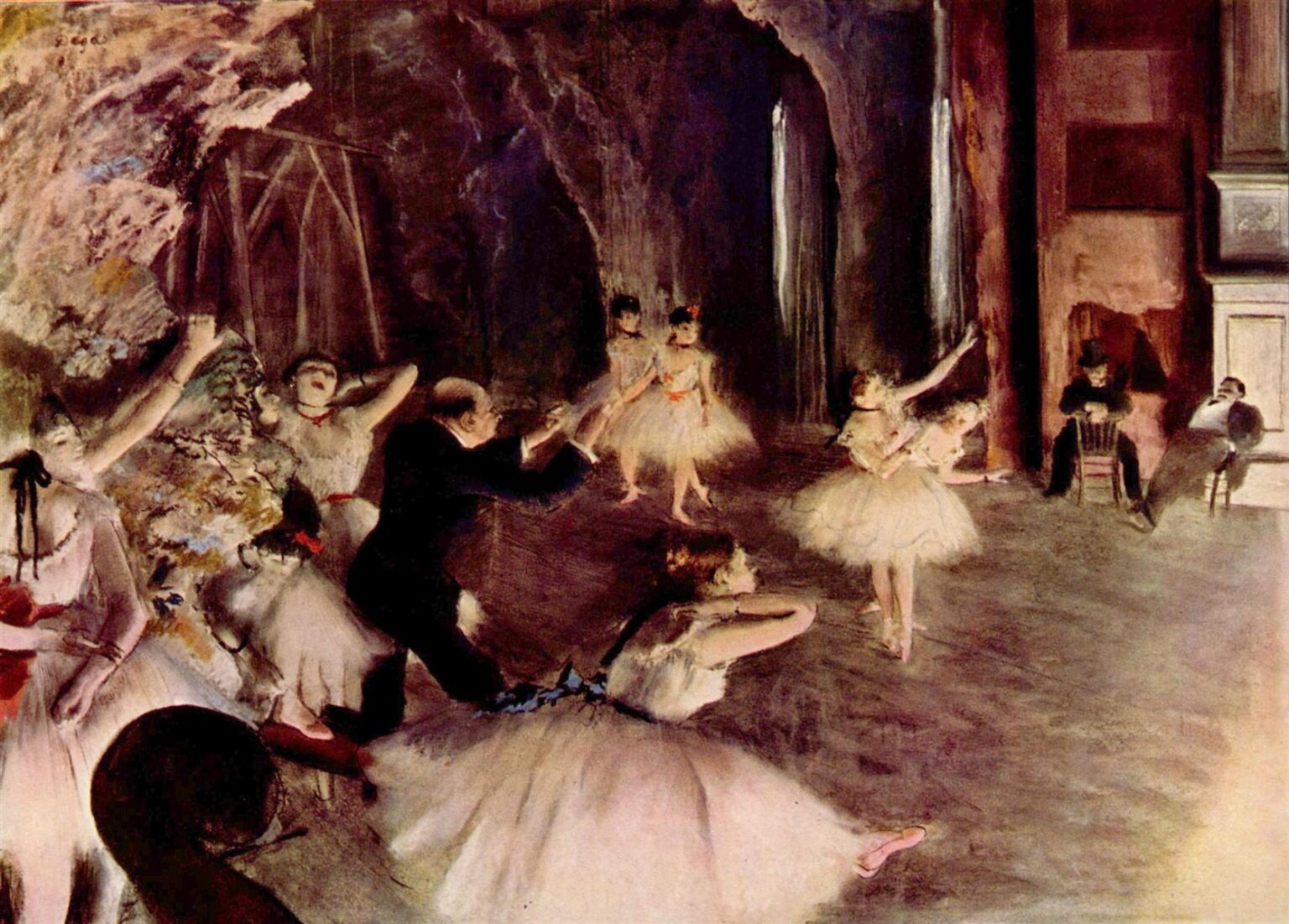 Edgar Degas’s 1874 painting “The Rehearsal of the Ballet on Stage,” showing ballerinas in white tutus rehearsing under dim theatrical light with a ballet master directing them on a crowded stage.