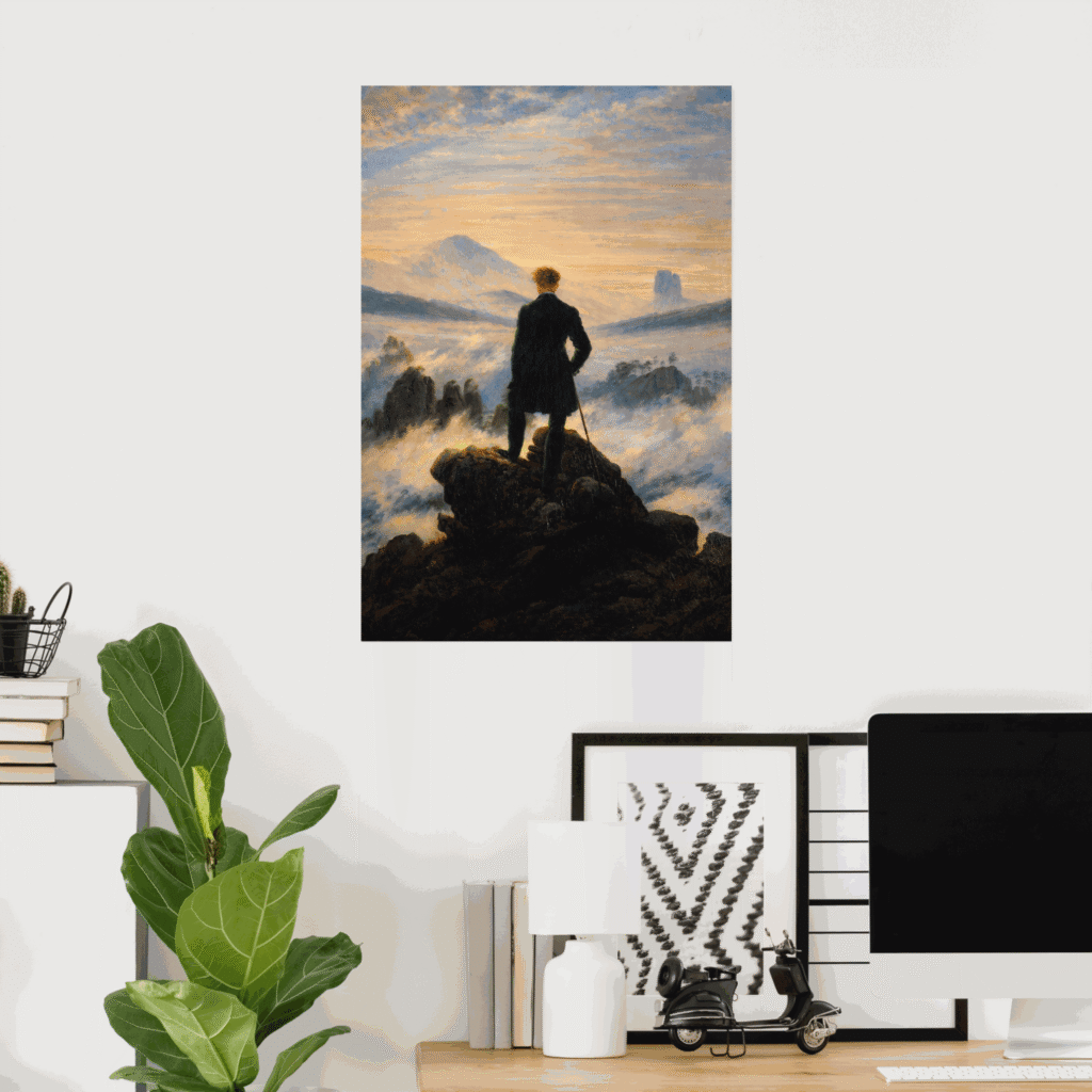Poster of The Wanderer Above the Sea of Fog by Caspar David Friedrich, showing a lone man standing on a rocky peak above a misty mountain landscape at sunrise, displayed as romantic wall art in a modern home office.