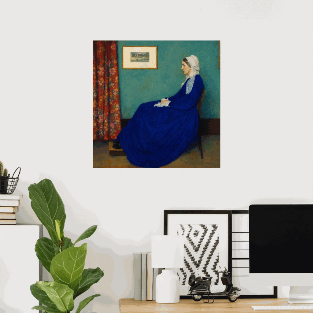 Poster of Whistler’s Mother by James McNeill Whistler displayed on a home office wall, featuring the iconic portrait of a seated woman in a blue dress and white bonnet against a muted interior background.