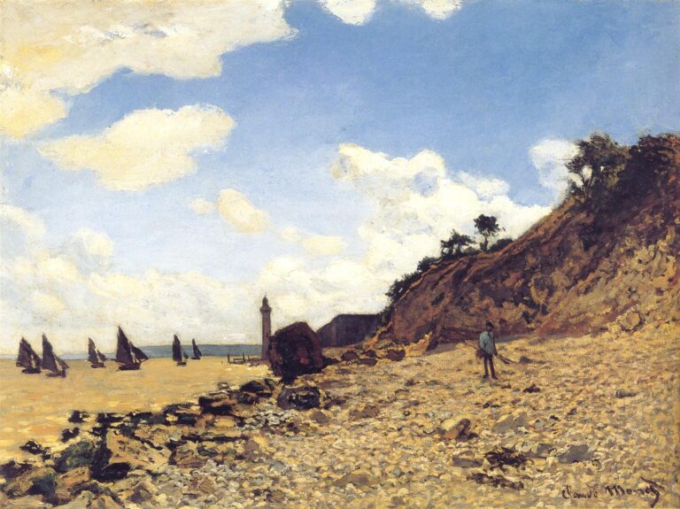 Claude Monet’s The Beach at Honfleur shows a sunlit pebbled beach in Normandy with dark sailboats on calm water, a steep cliff rising at the right, a small standing figure near the shore, and large white clouds drifting across a bright blue sky.
