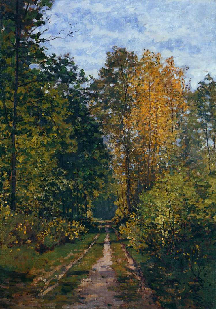 Claude Monet’s Wooded Path shows a narrow dirt road leading into a dense woodland, framed by dark green trees and golden autumn foliage beneath a pale blue, cloud-streaked sky.